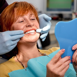 patient smiling with new dentures Costa Mesa