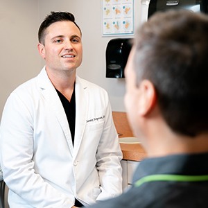 older woman smiling at dentist