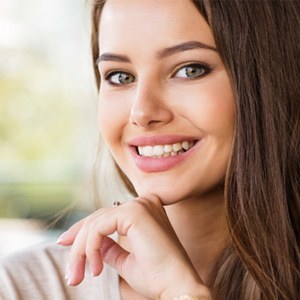 patient smiling after getting dental bridge in Costa Mesa