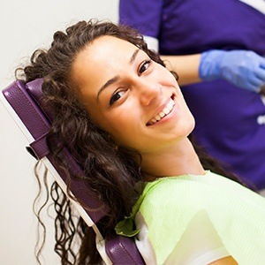 woman laying back in exam chair