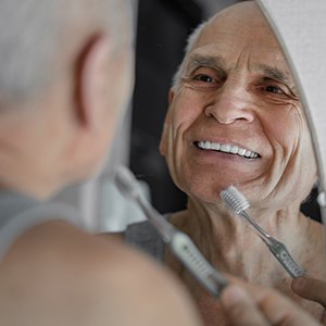 Full set of dentures on a white surface