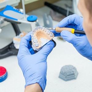 a closeup of dentures being created