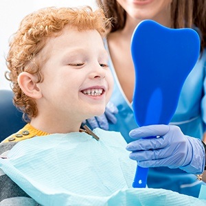 boy smiling in mirror