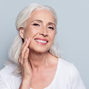 woman with dental implants showing off her smile