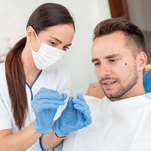 Dentist discussing Invisalign in Costa Mesa with patient