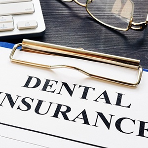 Closeup of dental insurance paperwork on desk