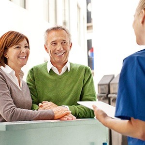 husband and wife at front desk