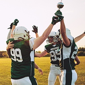 football team with trophy