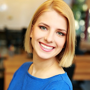 woman in blue smiling