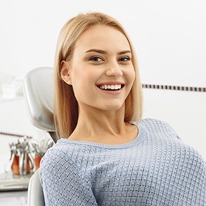 woman in grey sweater smiling