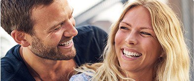 husband and wife laughing together