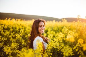 woman smiling in field