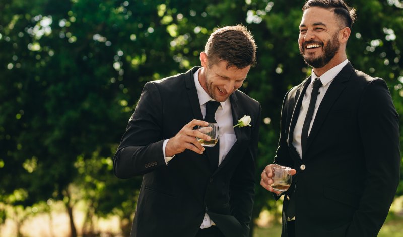 men laughing and smiling at special event