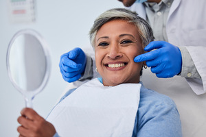 Senior woman smiling at dentist’s office