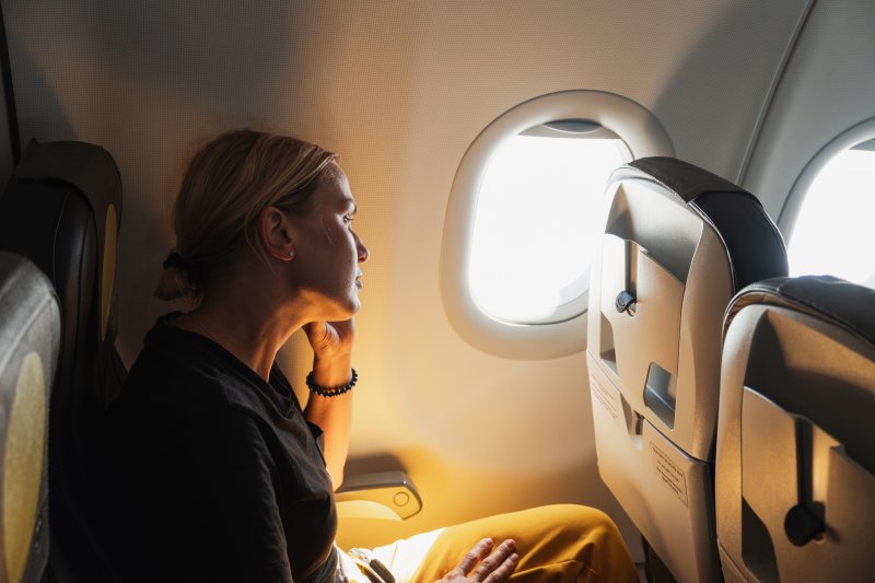woman sitting in airplane seat