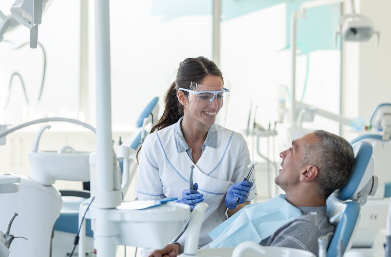 Dentist in Costa Mesa talking to patient