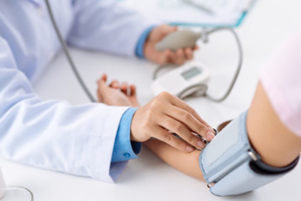 Patient at the dentist’s office having their blood pressure measured.